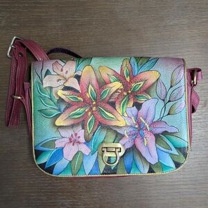 Anuschka Red and Green Crossbody Bag with Artistic Floral Design